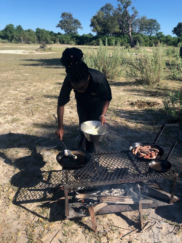 woman cooking outdoor bush breakfast